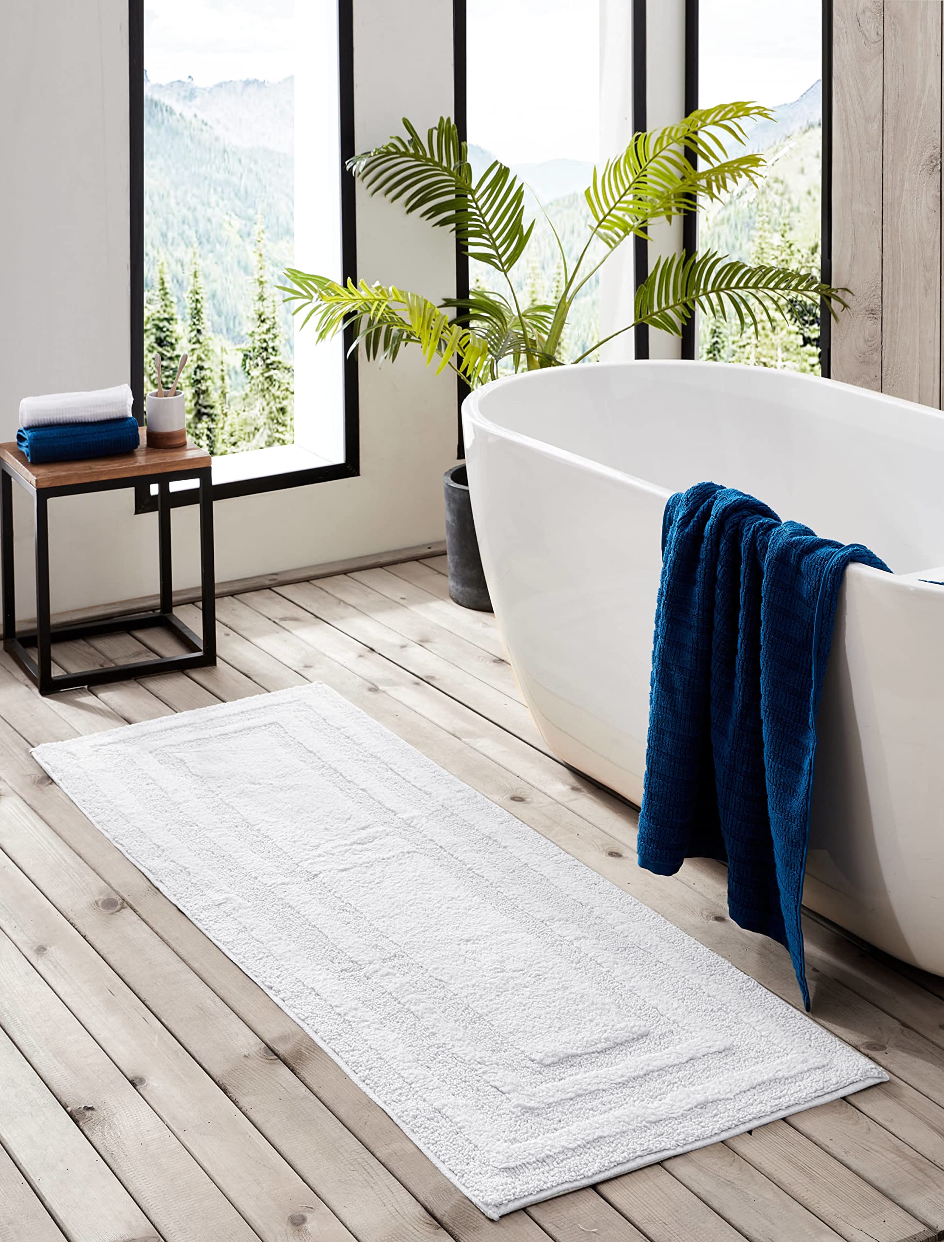 This rug's absorbent cotton dries quickly to keep floors drier after showers.