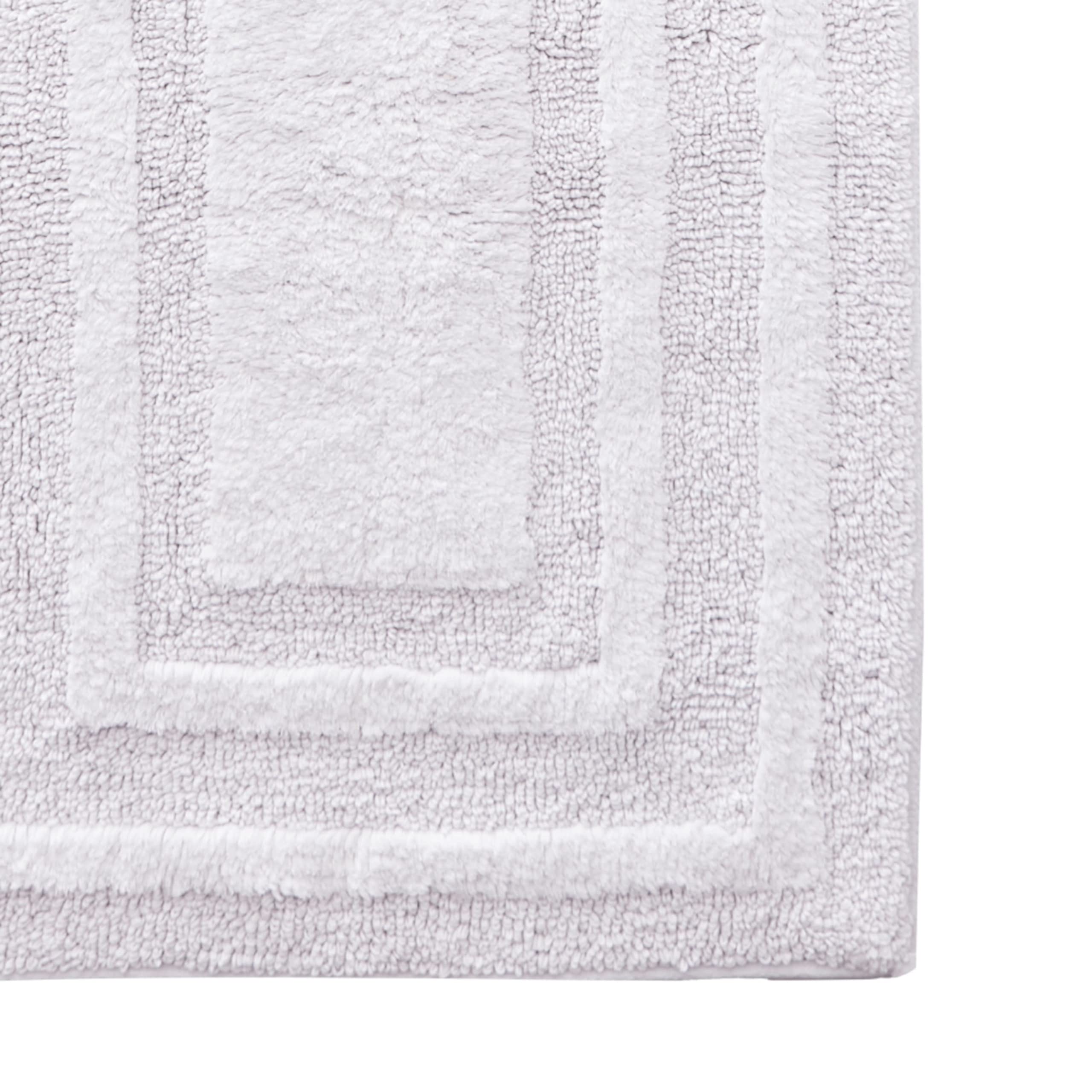 22 by 60 inches, ideal for long bathroom runners and tub entrances.