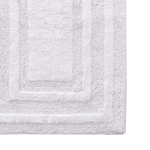 22 by 60 inches, ideal for long bathroom runners and tub entrances.