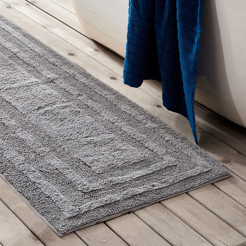 Eddie Bauer bath rug with non-slip backing on wet bathroom floor