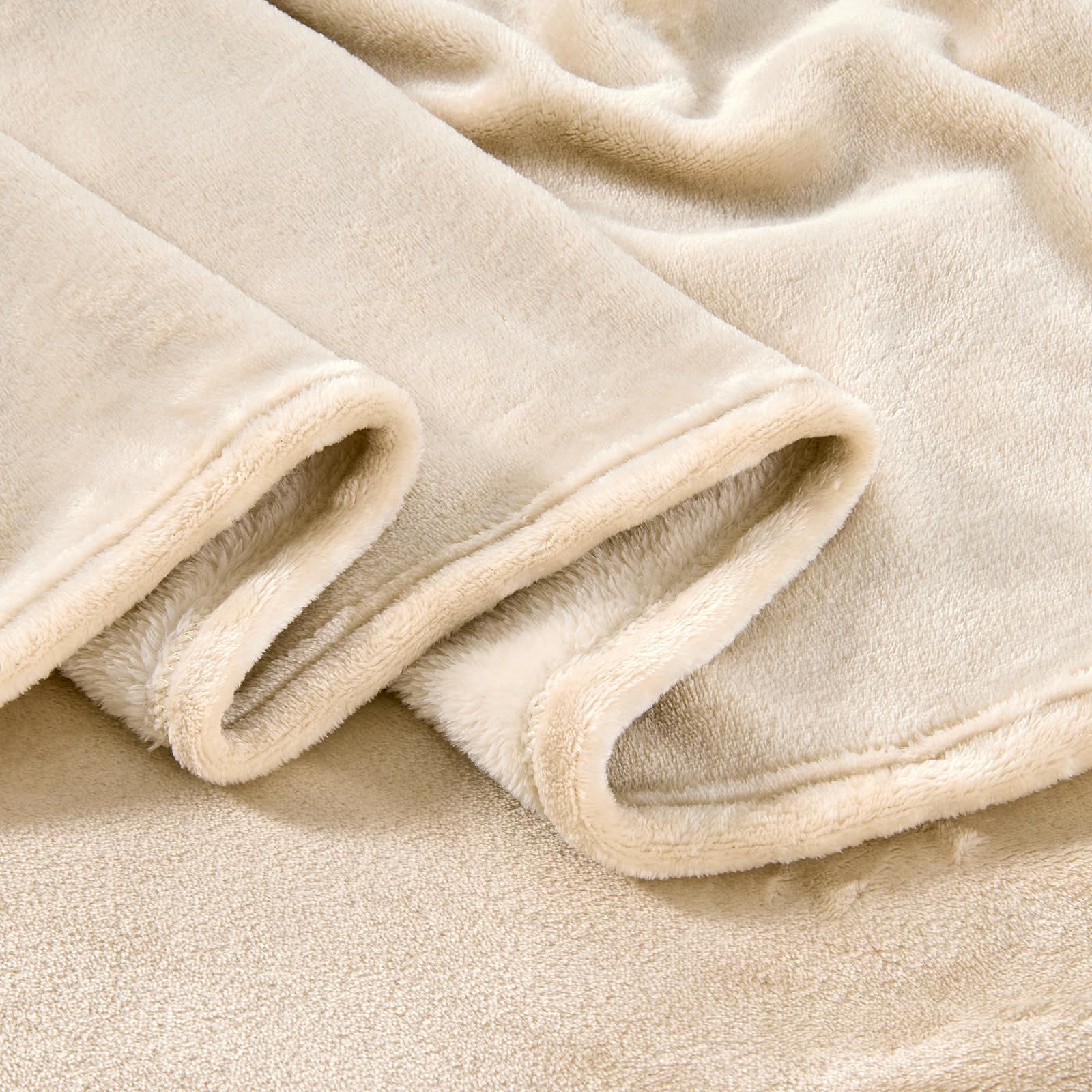 Edenleaf khaki-colored oversized blanket adds versatile warmth at home.