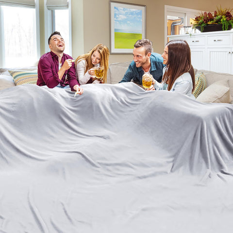 Edenleaf oversized blanket 120x120 on bed and sofa offers cozy warmth for the whole family.