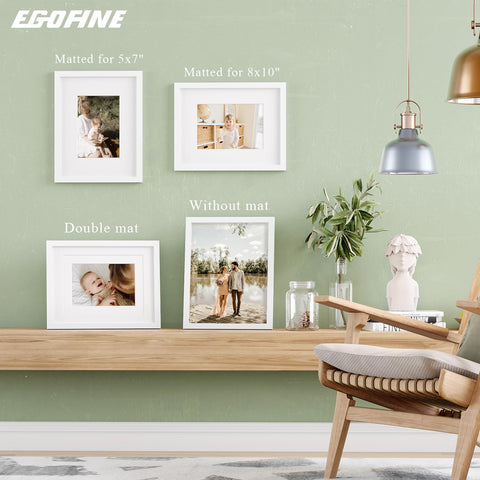 Egofine set of four white frames creates a cohesive gallery look at home or office.