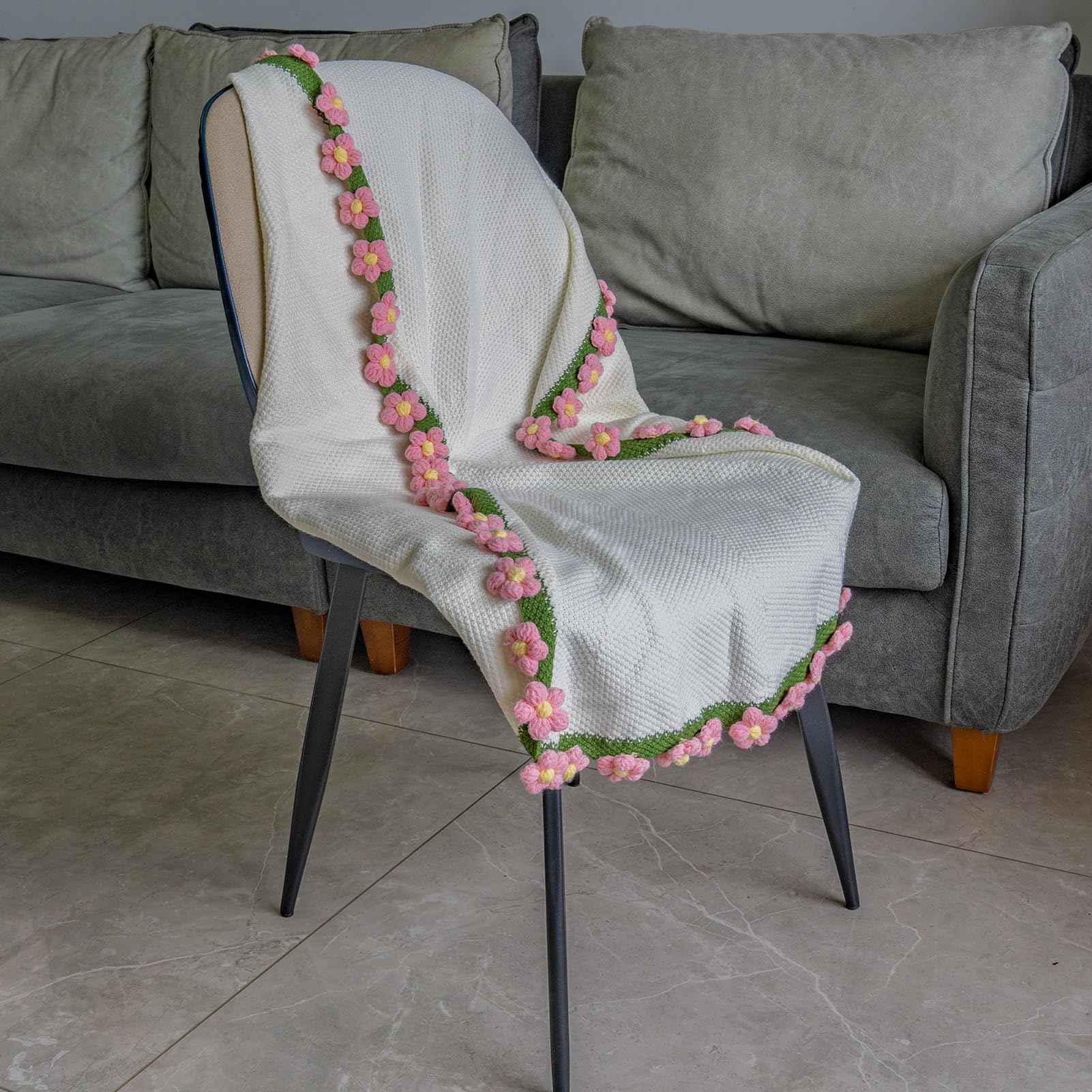 Eightown blanket on cozy couch showcases seasonal comfort and style.
