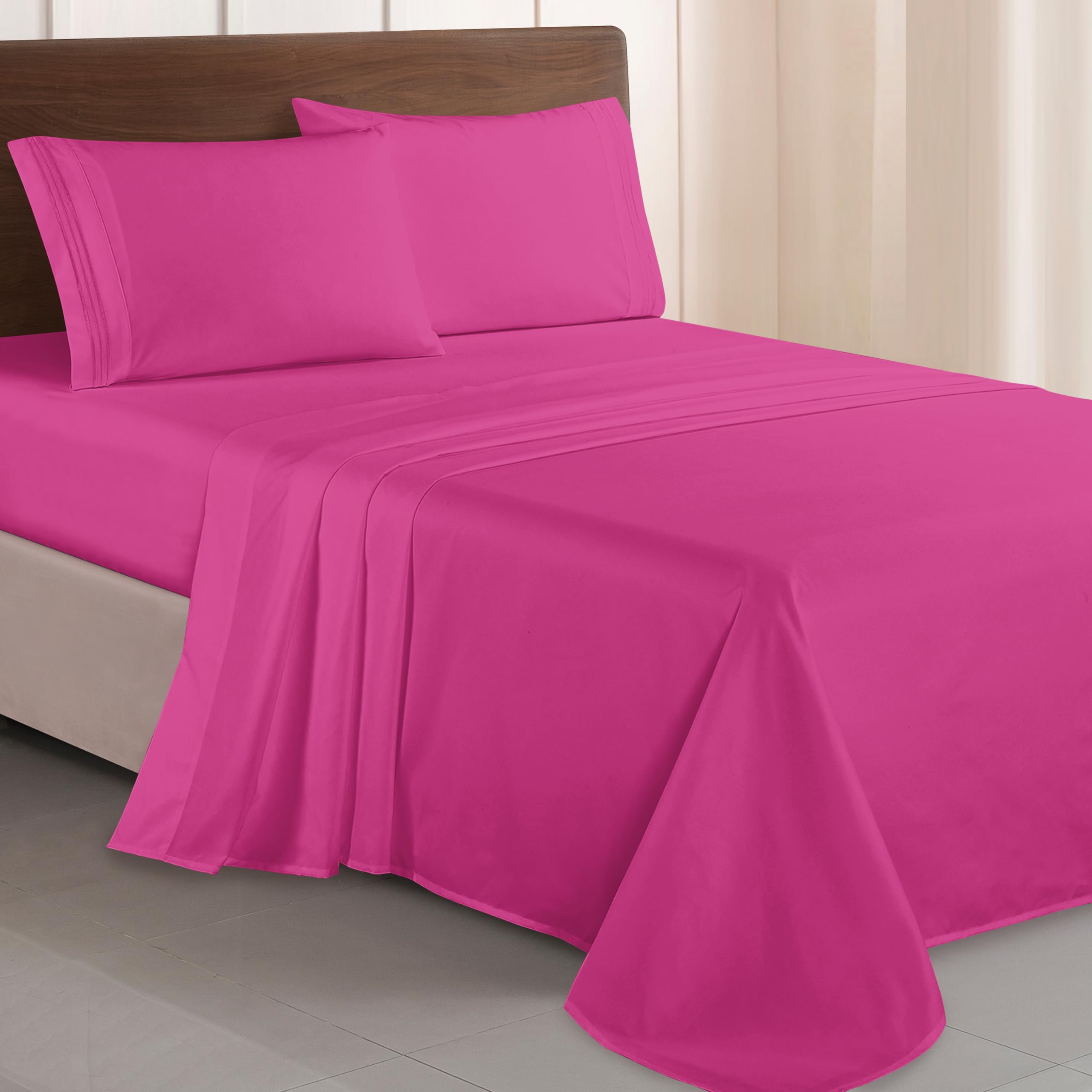 Elegant Comfort pillowcases with three-line embroidery add a refined look and plush feel.