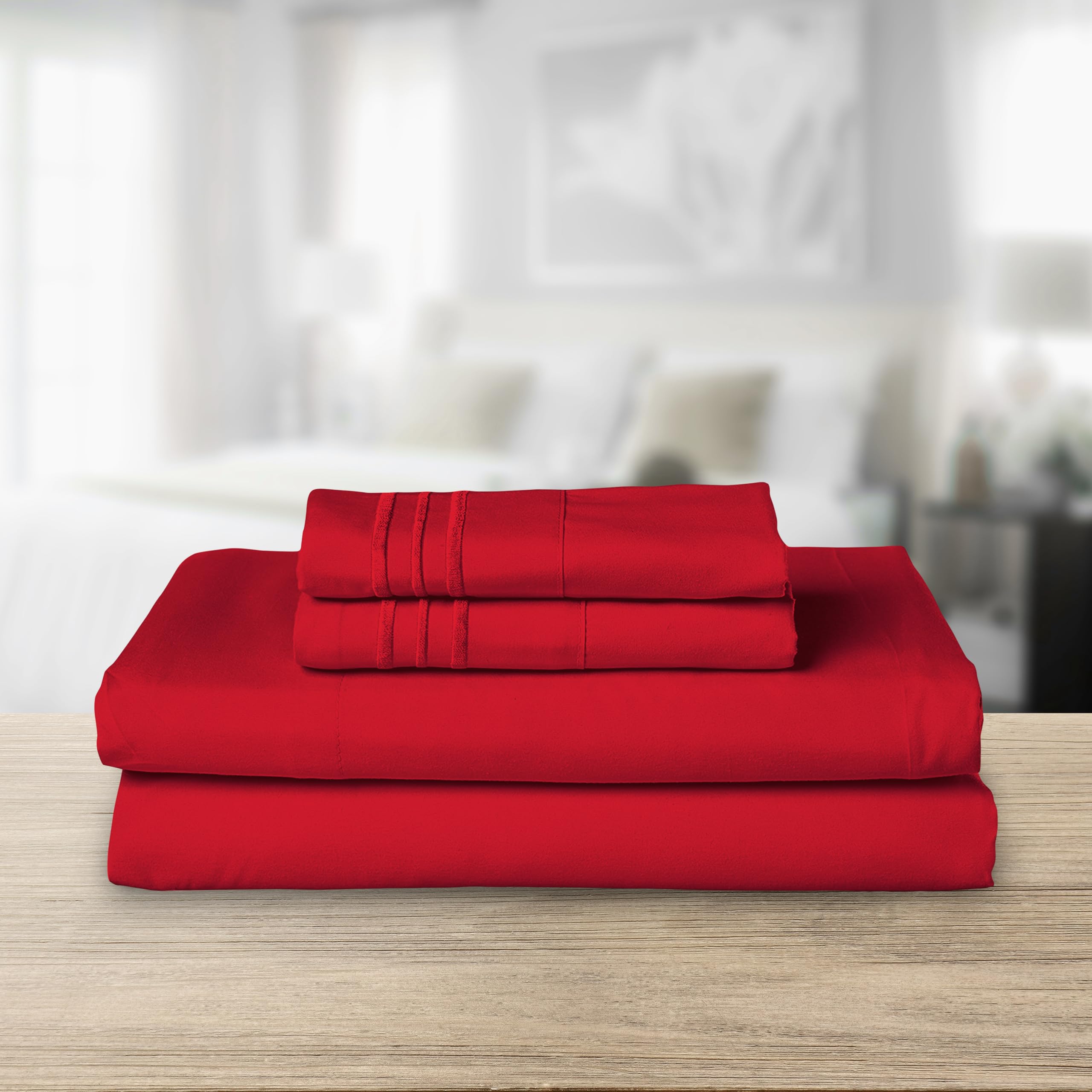 Elegant Comfort pillowcases with embroidered lines highlight refined styling and soft touch.