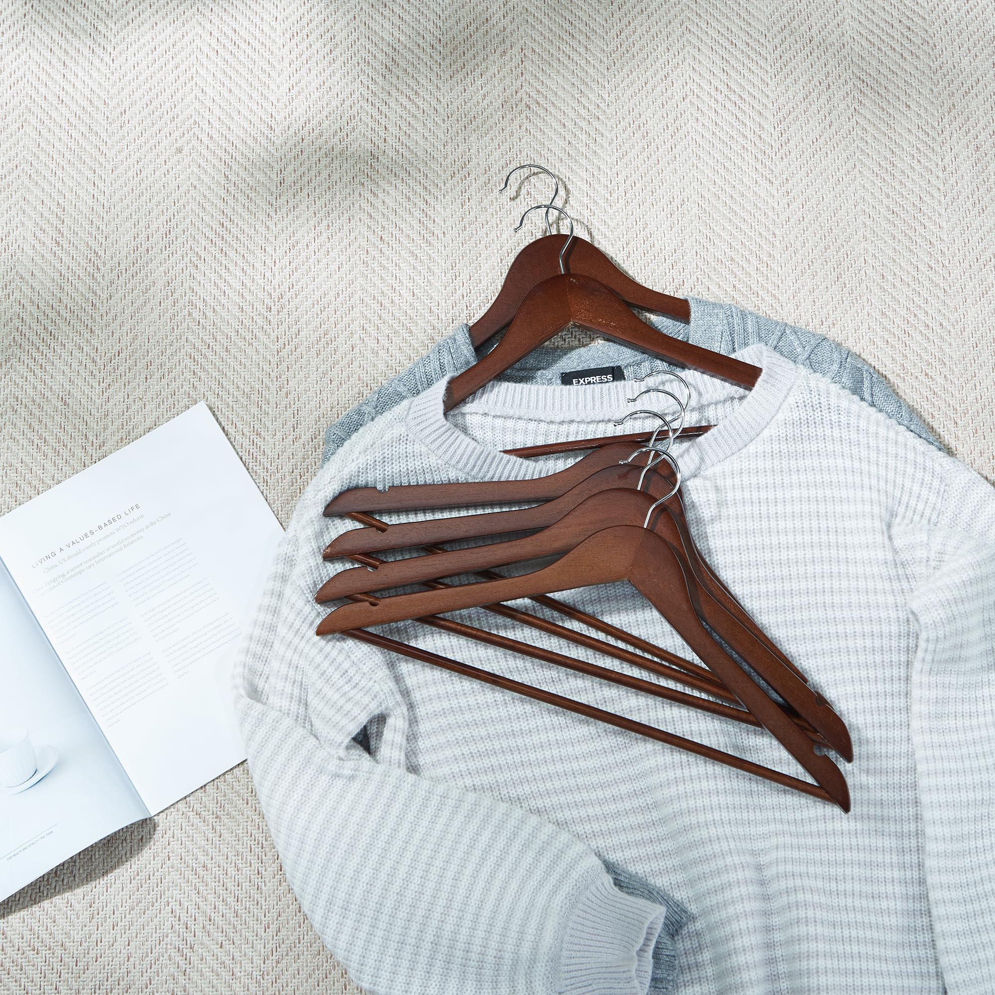 Smooth finish on ELONG HOME wooden hangers protects fabrics from snagging.