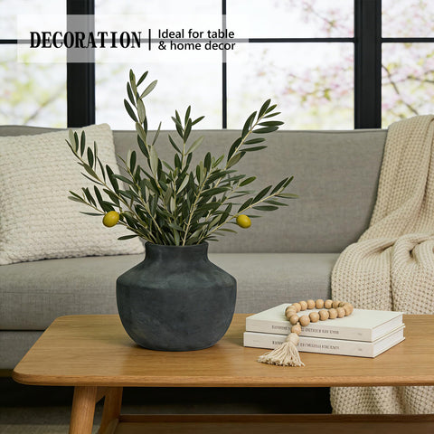 ELY SIIRENA vase centerpiece display on a dining table with dried stems.