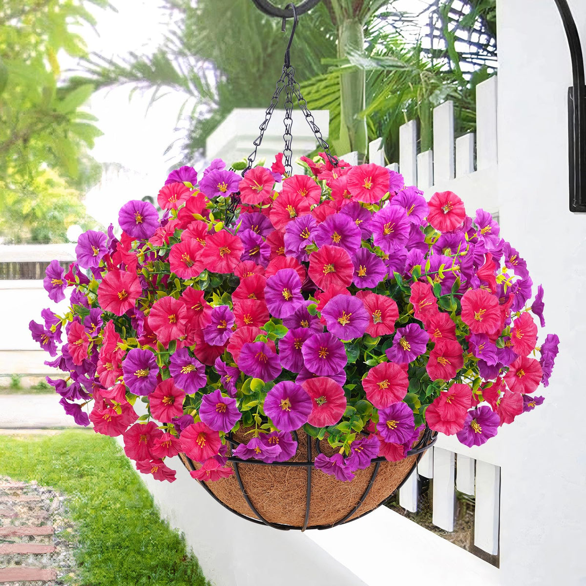 Elyum outdoor petunias hanging basket in purple and fuchsia for curb appeal.