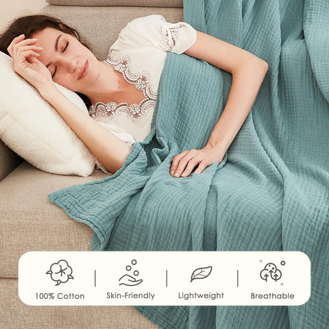 EMME cotton gauze blanket draped as a lightweight, cozy cover