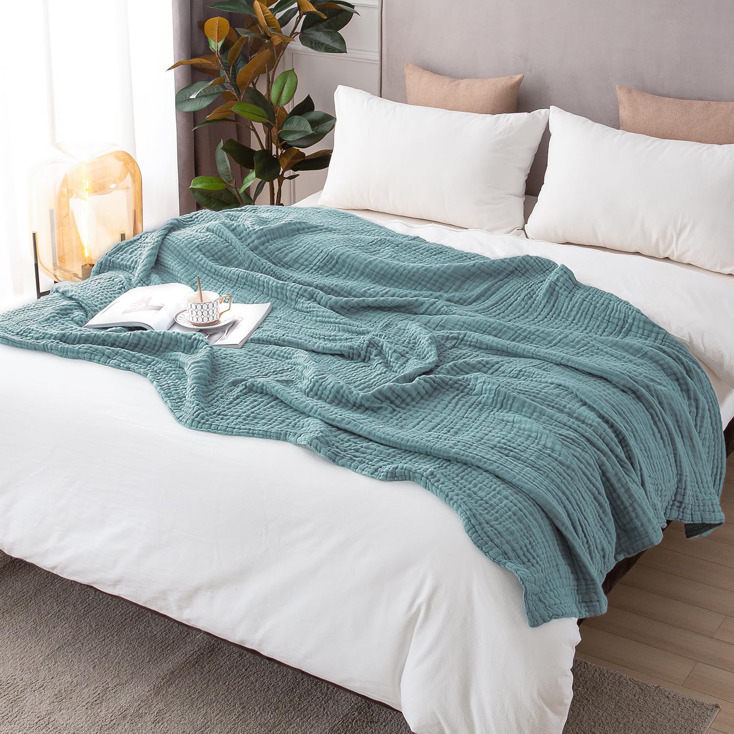 EMME blanket teal on chair demonstrates easy care in laundry