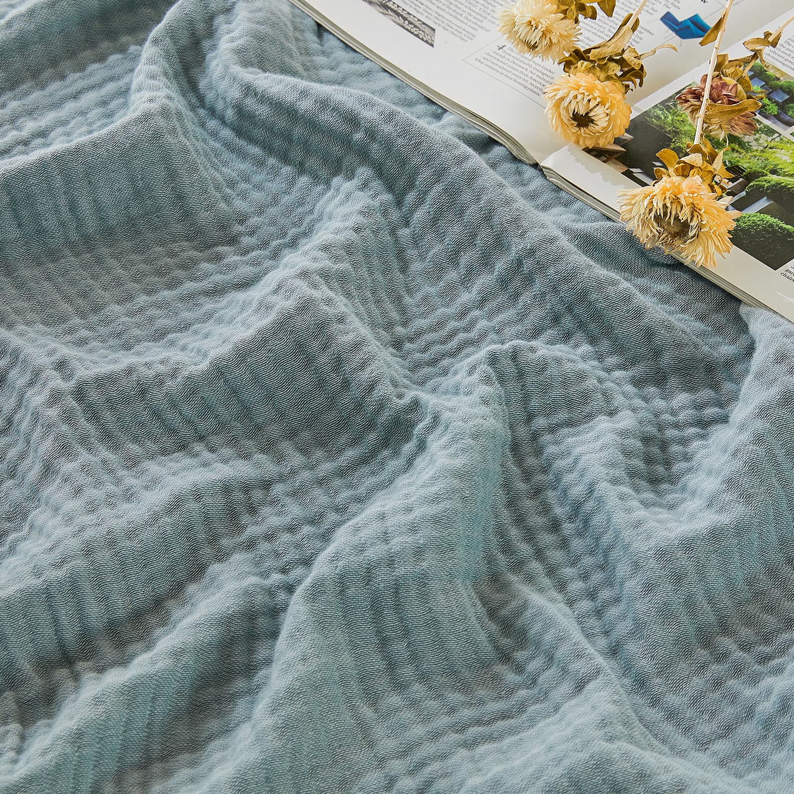 EMME Cotton Muslin Large Throw Blanket on couch offers breathable comfort