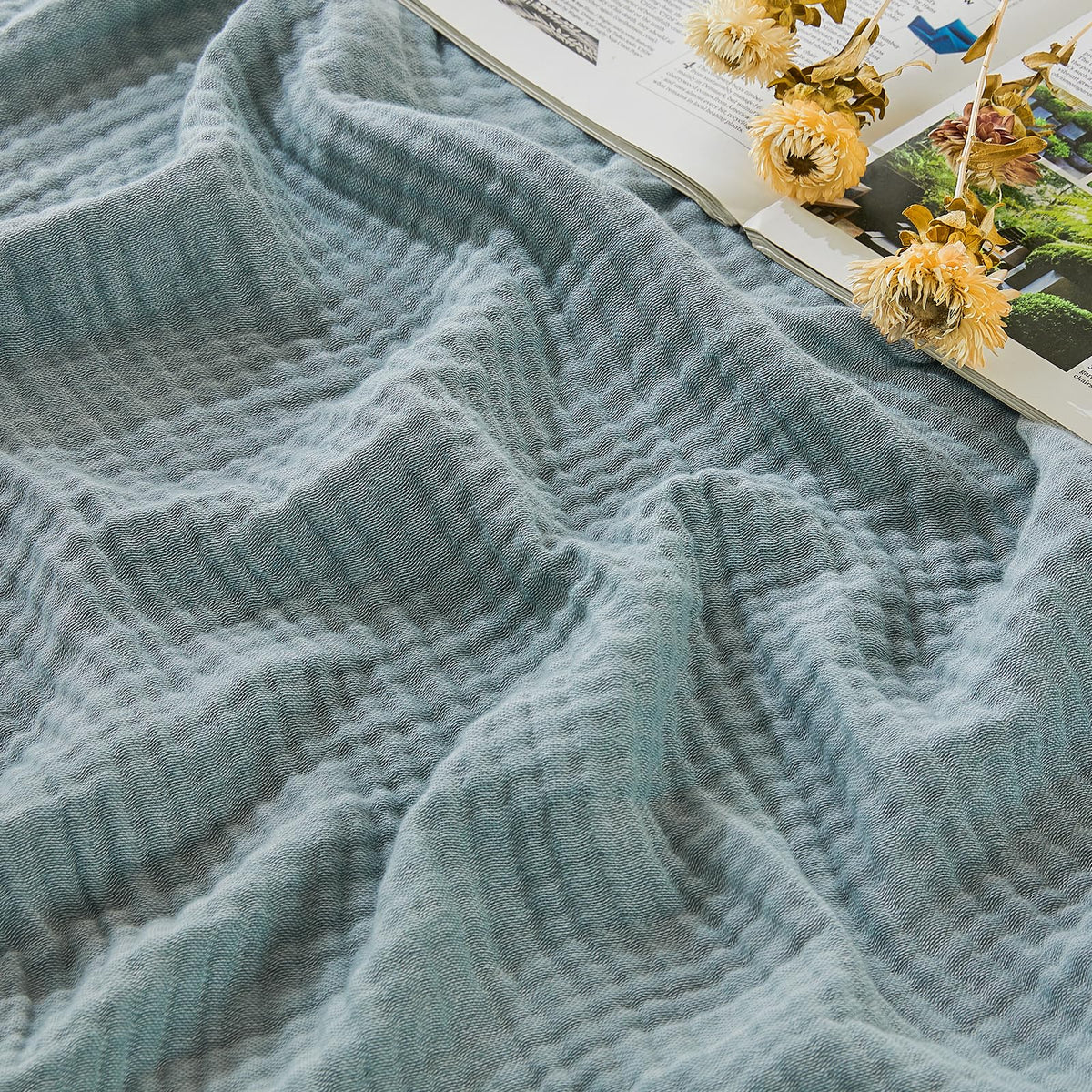 EMME Cotton Muslin Large Throw Blanket on couch offers breathable comfort
