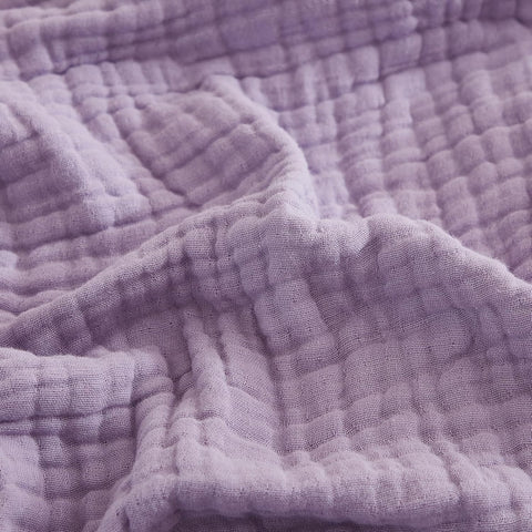 EMME cotton throw blanket lavender on couch offers cozy all-season comfort.
