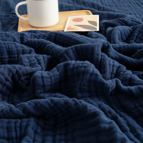 EMME muslin blanket navy 50x70 laid flat shows size and soft texture