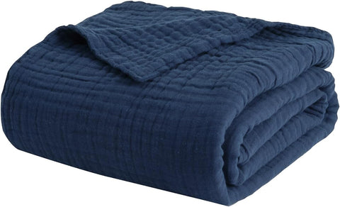 Gift-ready navy EMME muslin blanket packaging and presentation