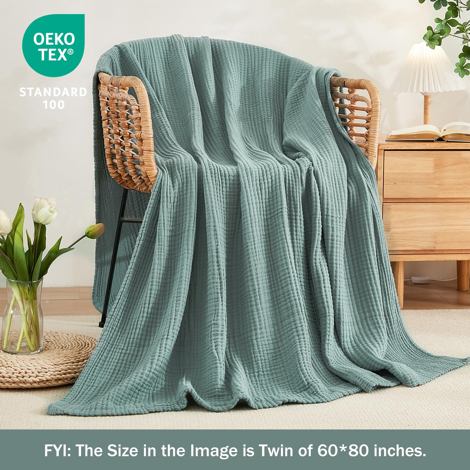 EMME teal muslin blanket doubles as a stroller cover for on-the-go protection.