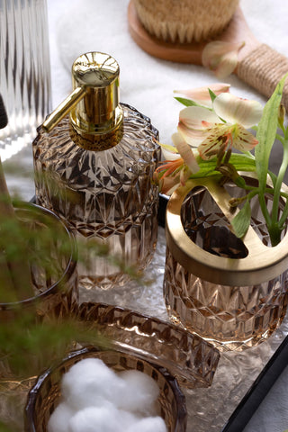 EMPO diamond-cut glass reflects light for a luxe vanity look.