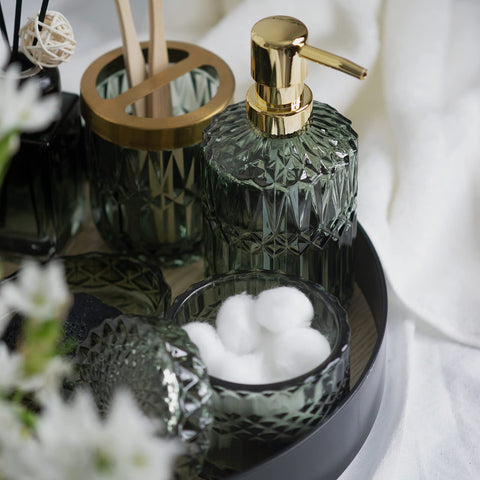 EMPO green glass six-piece set on vanity demonstrates cohesive styling