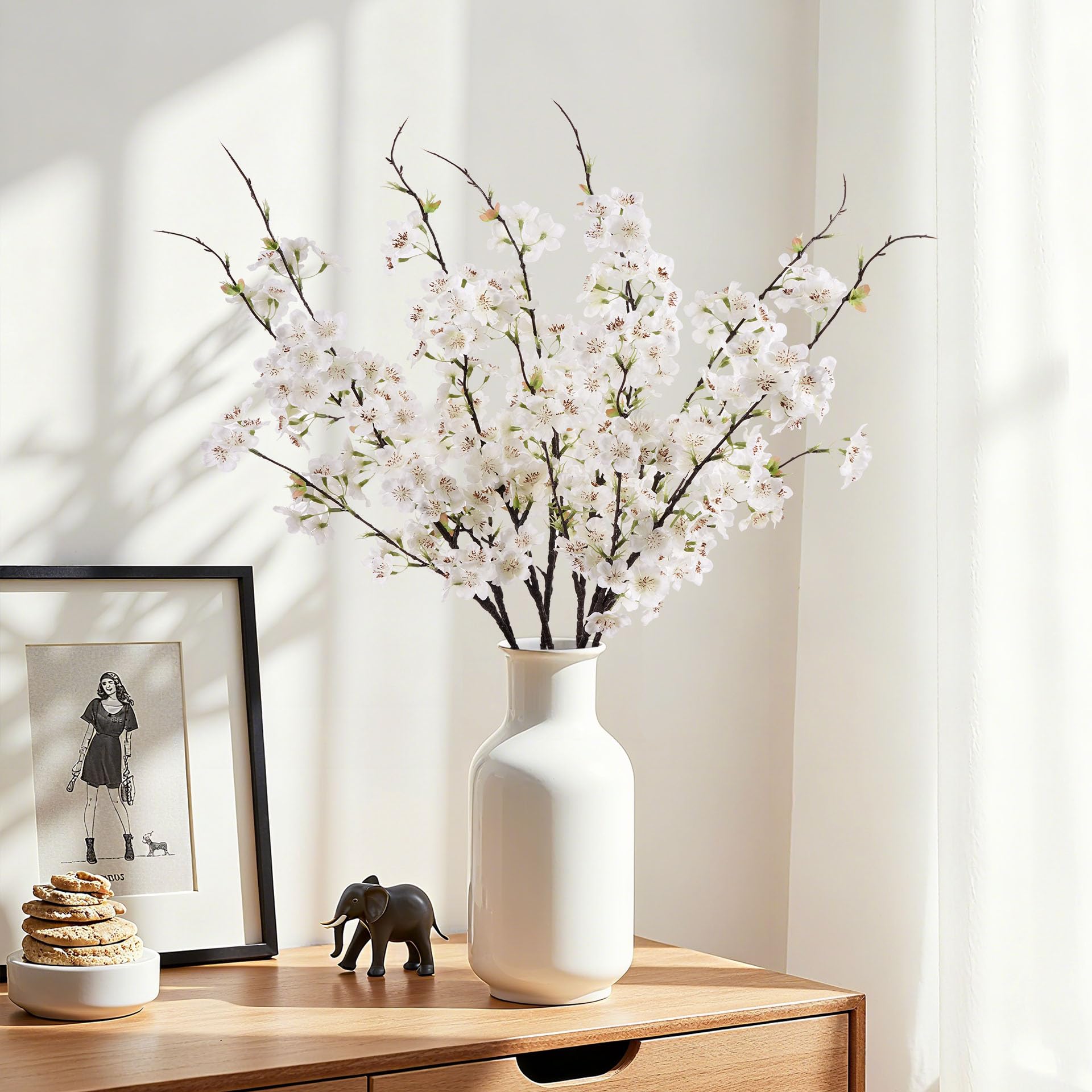 ENALGRE cherry blossom branch in a tall vase for dramatic centerpiece
