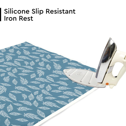 Encasa XO ironing mat shows integrated silicone iron rest for safe placement.