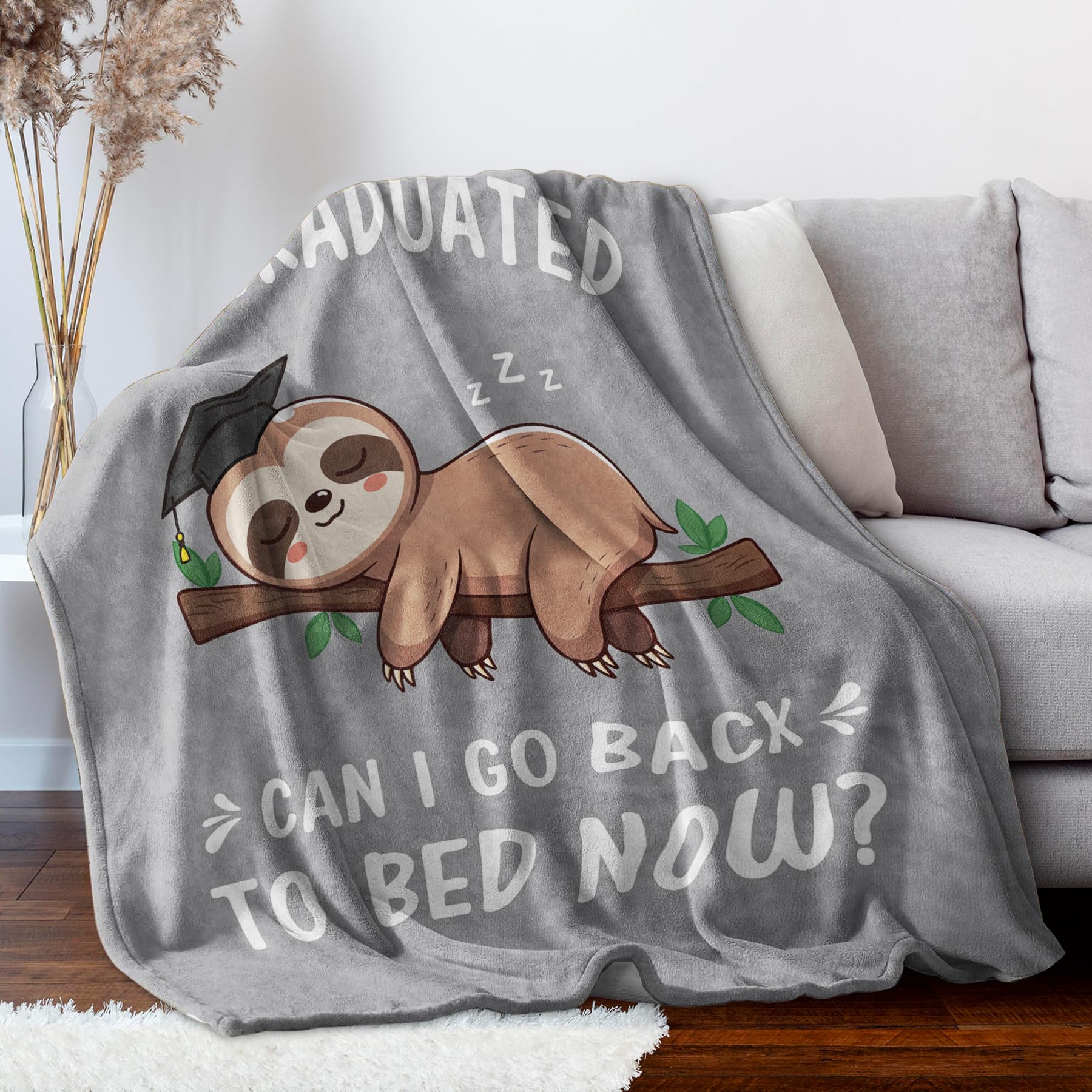Encoink sloth blanket in a cozy bedroom adds soft decorative touch.