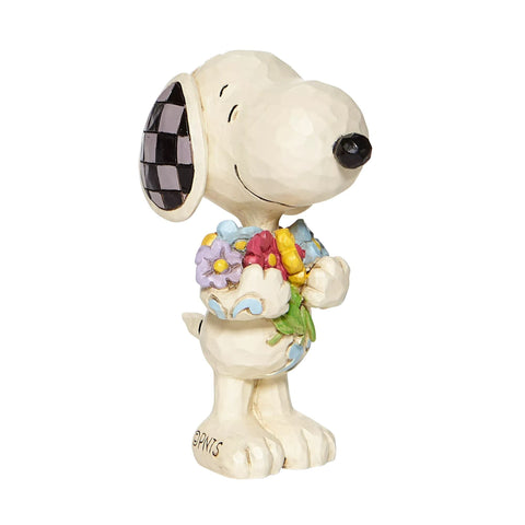 Jim Shore Snoopy holding flowers 3-inch figurine in display-ready form.