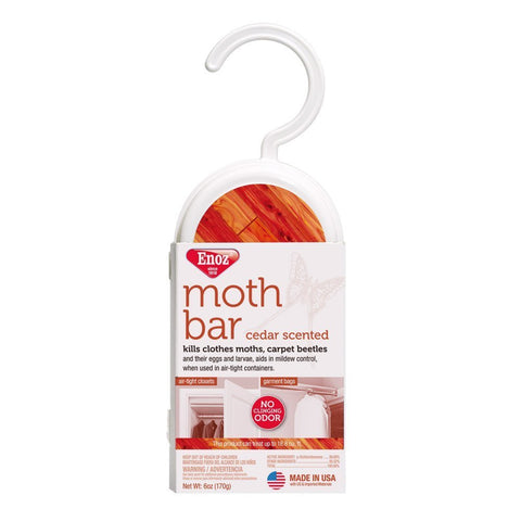 Enoz cedar-scented moth cakes hanging in a closet protect garments from moths and beetles.