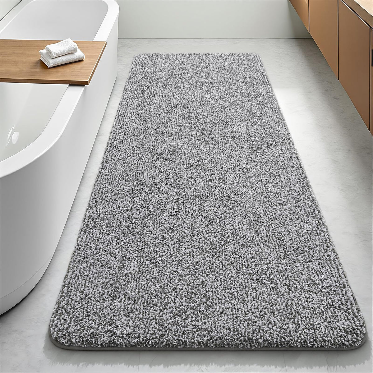 Enqinar bathroom runner rug 24x60 with soft absorbent fibers for plush post-shower comfort.