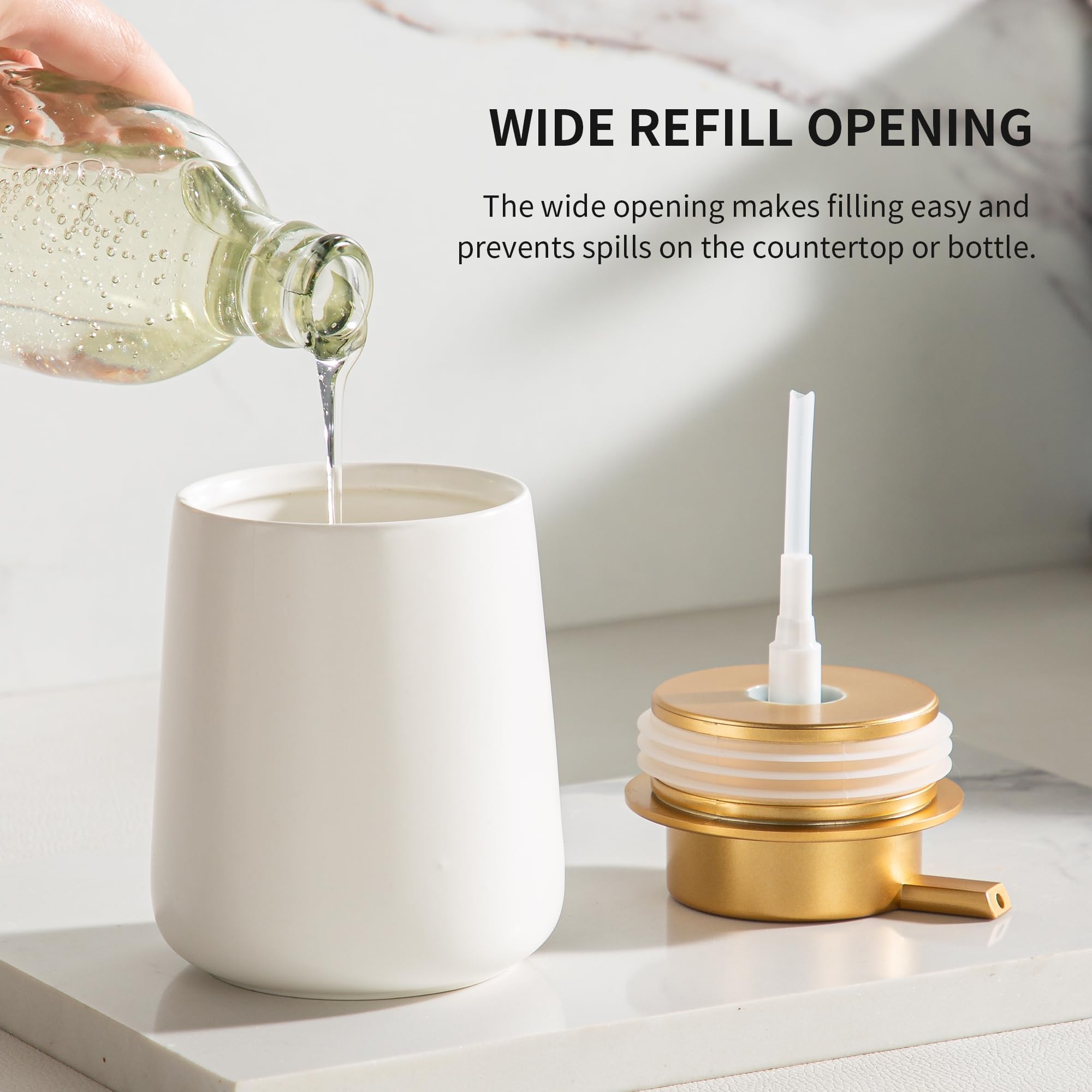 Enra ceramic dispenser with gold pump close-up in white finish.
