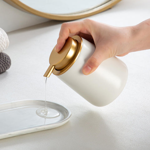 Enra dispenser shown as multi-use for soap, lotion or shampoo on a vanity.