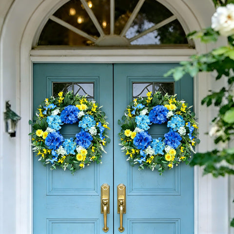 Eqanro outdoor wreath with blue hydrangeas and white daisies adds color to exteriors.