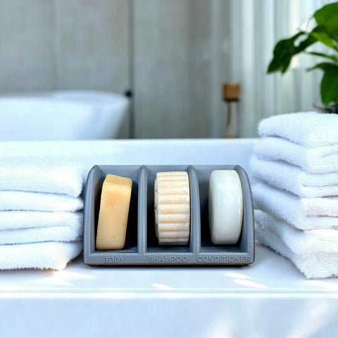 Raised design prevents water pooling around bars in a bathroom organizer