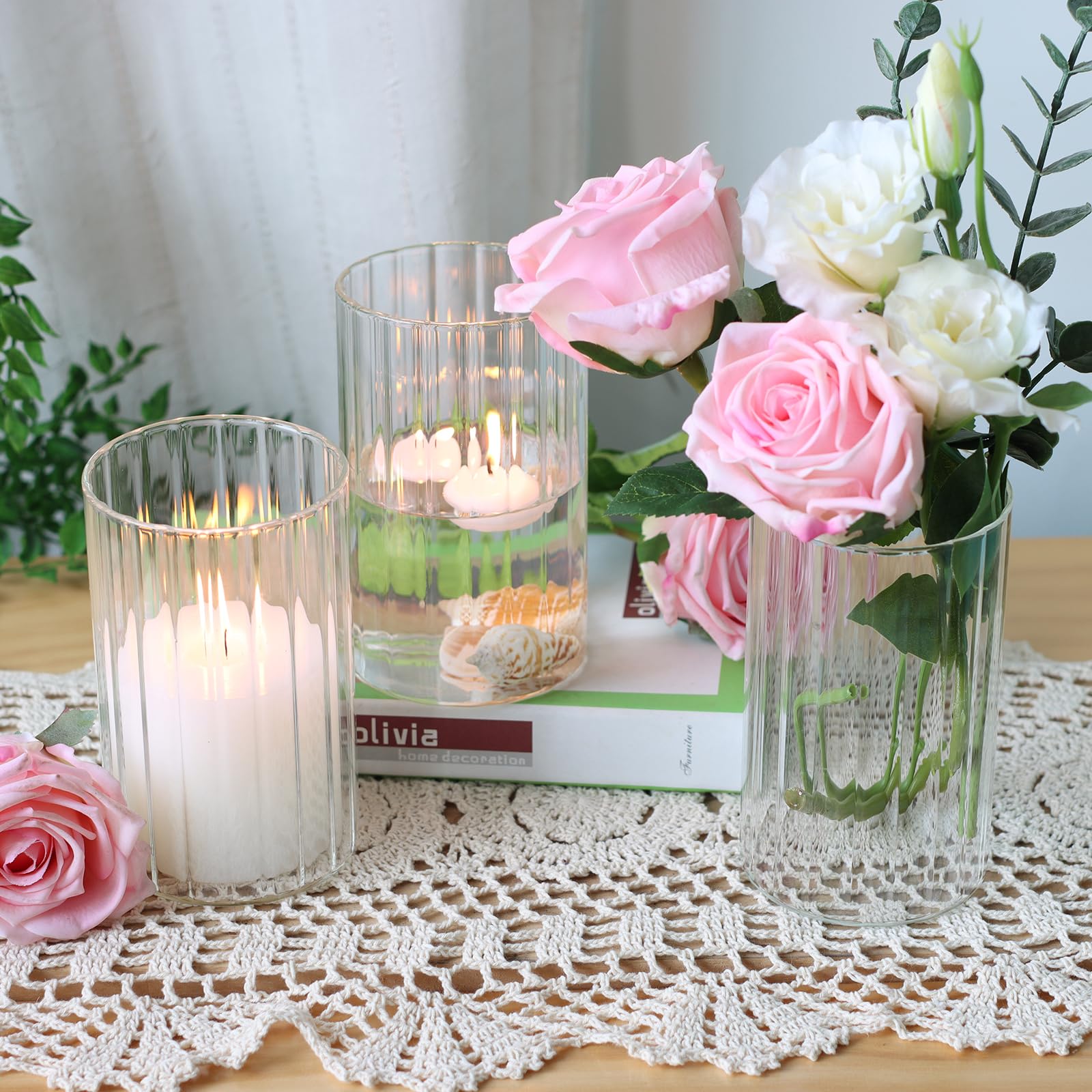 Etolies wedding centerpiece ideas using modern ribbed glass vases.
