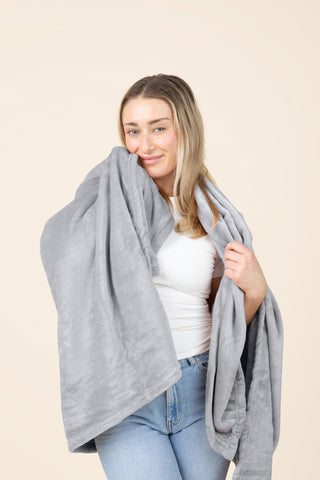 EverSnug travel blanket used as a pillow for restful travel
