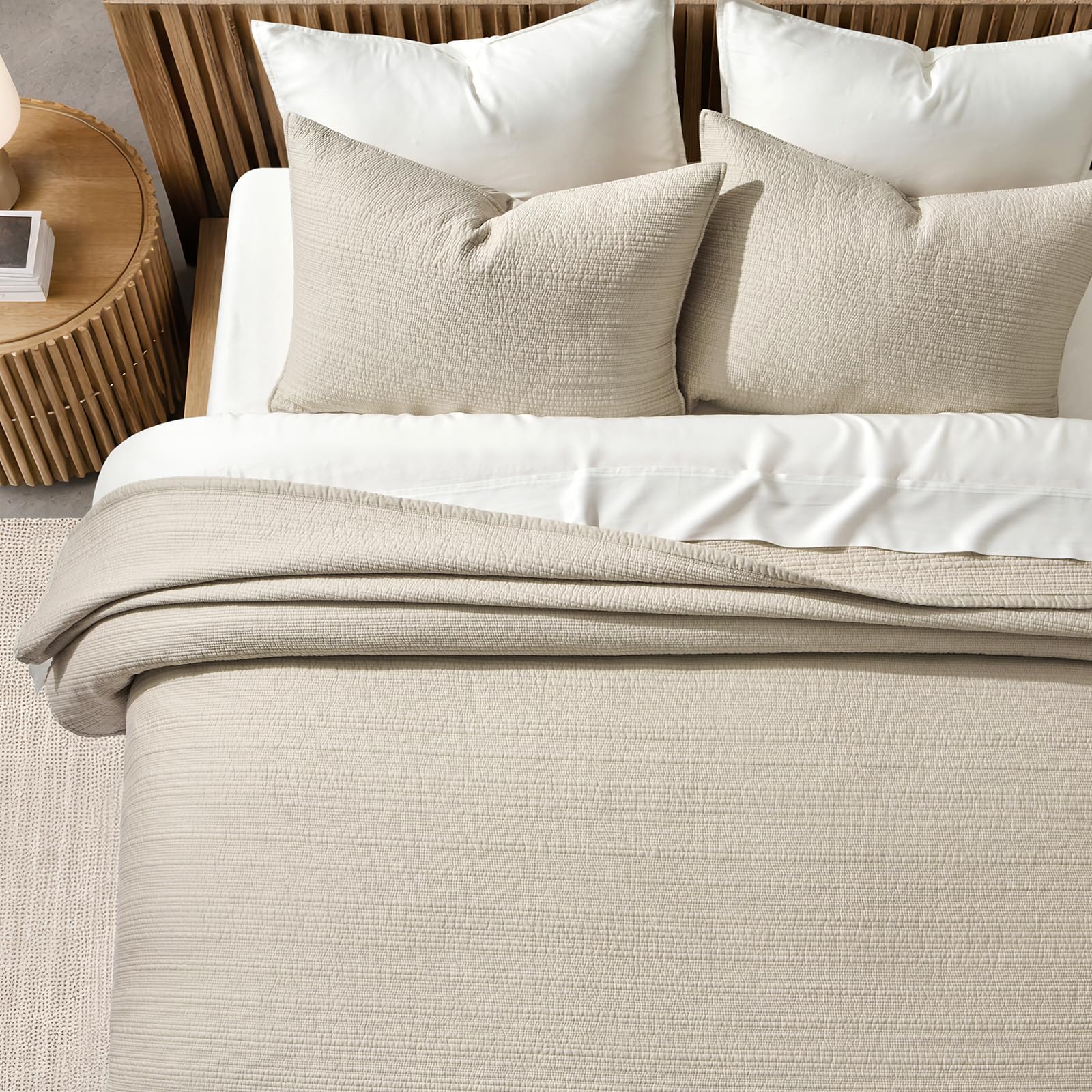 Quilt parchment drape on bed demonstrates oversized king fit and polished presence