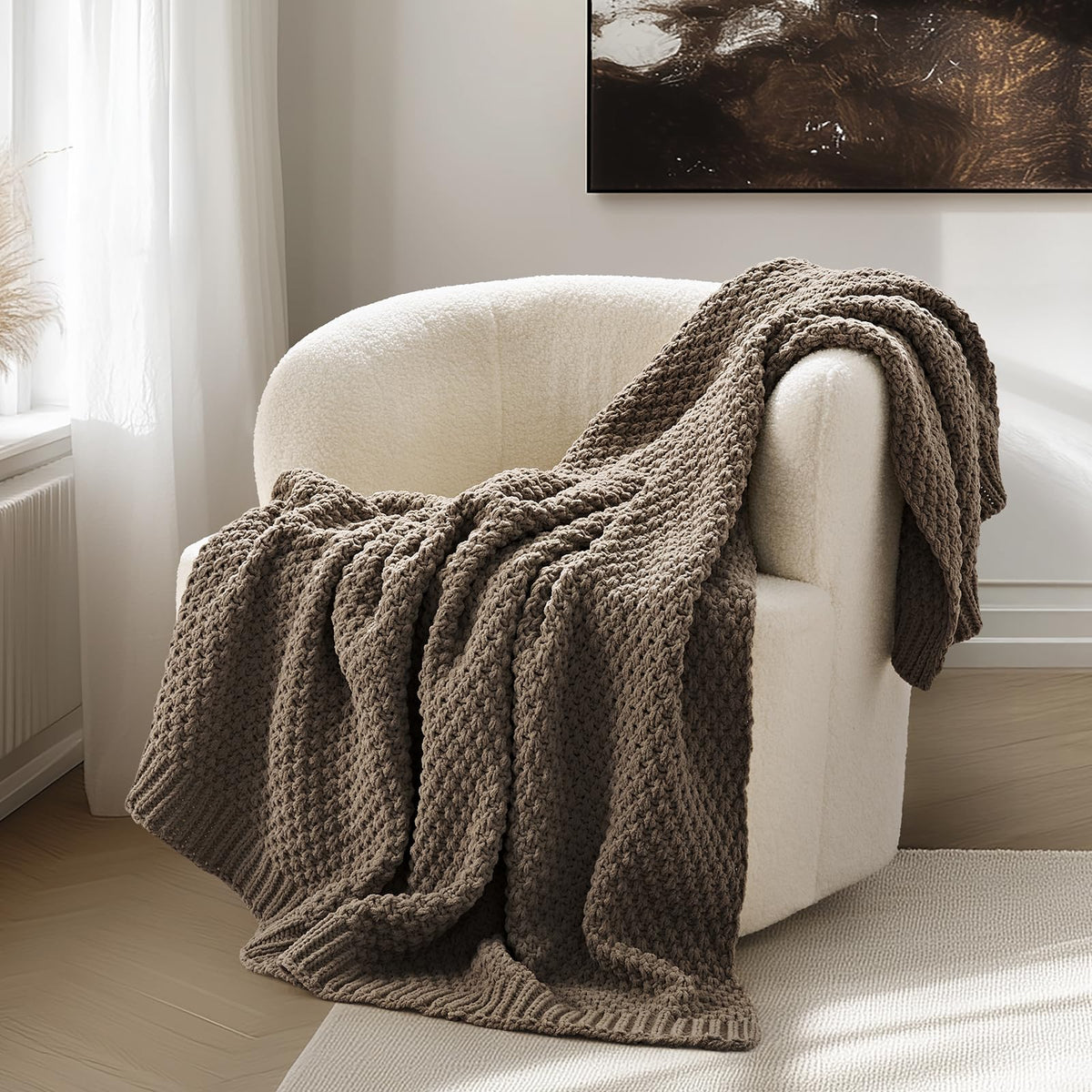 EVERGRACEHOME chunky chenille knit throw on sofa offers cozy texture and warmth.