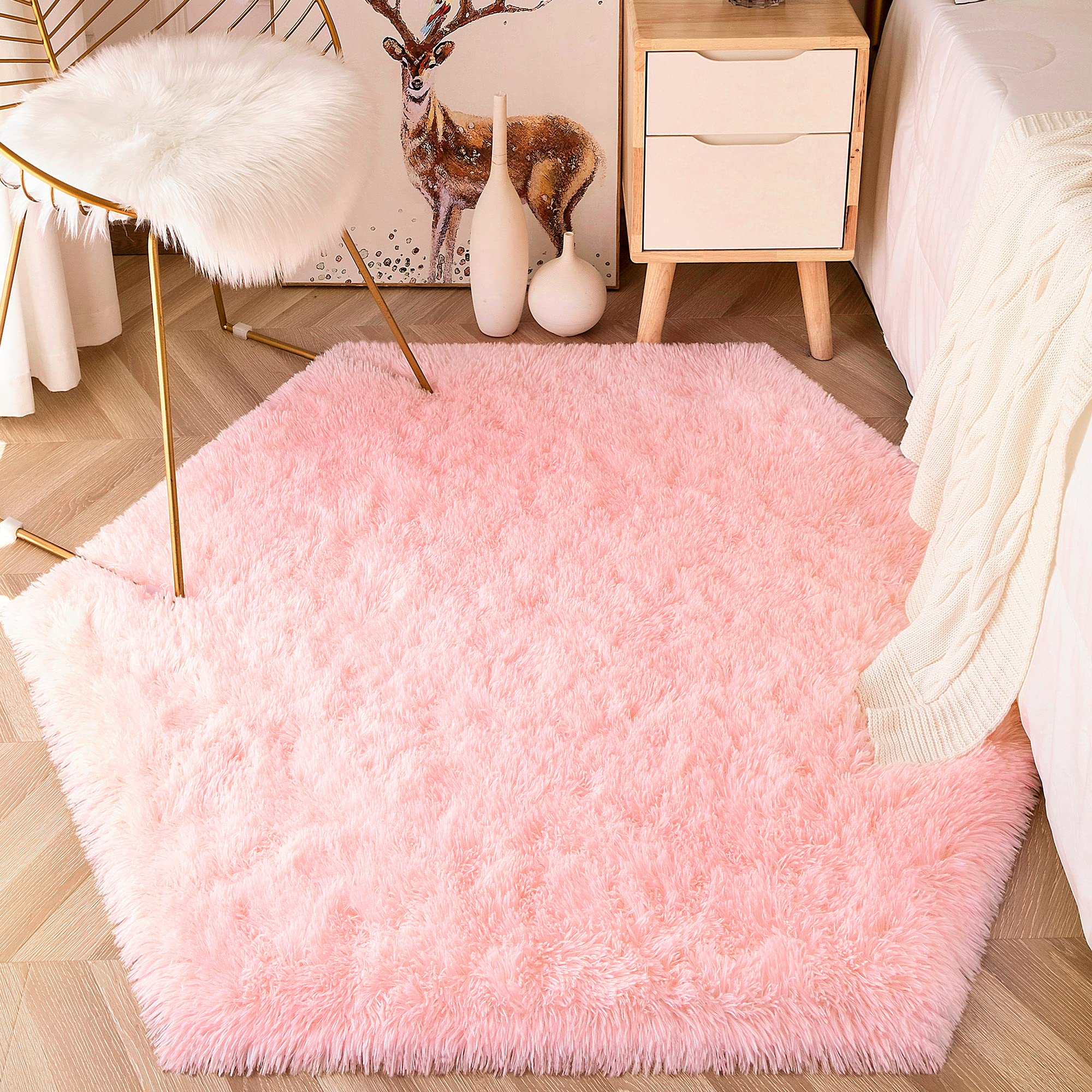 EVOIONOS pink hexagon rug creates a warm play area on the floor