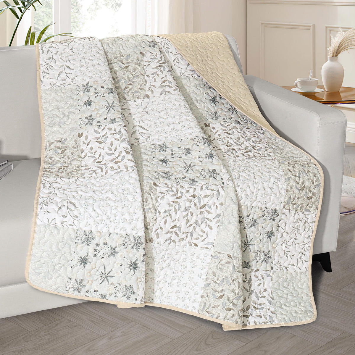 Exclusivo Mezcla 50x60 quilted throw with boho patchwork on bed for cozy decor.