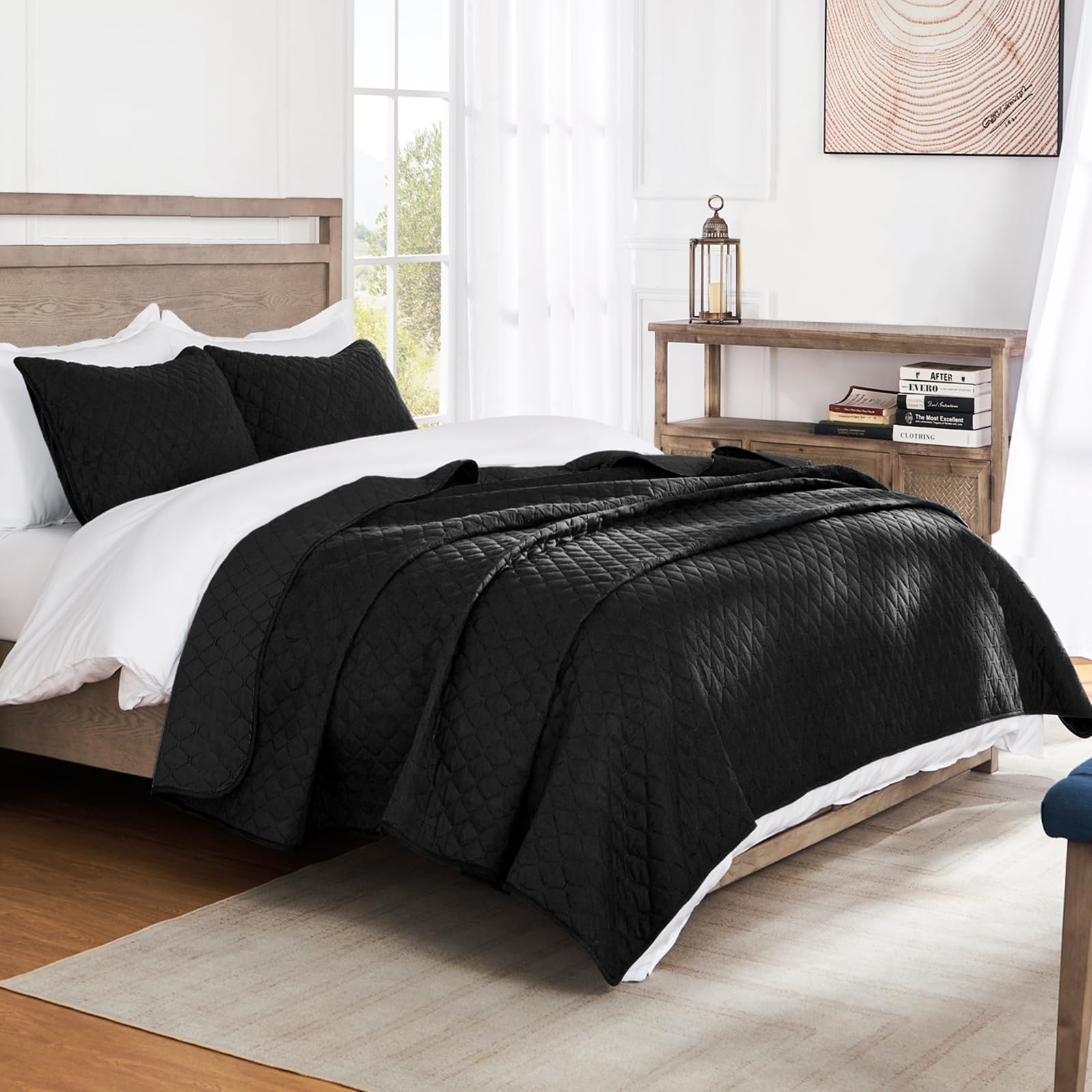 Two pillow shams complete the Exclusivo Mezcla quilt set in black