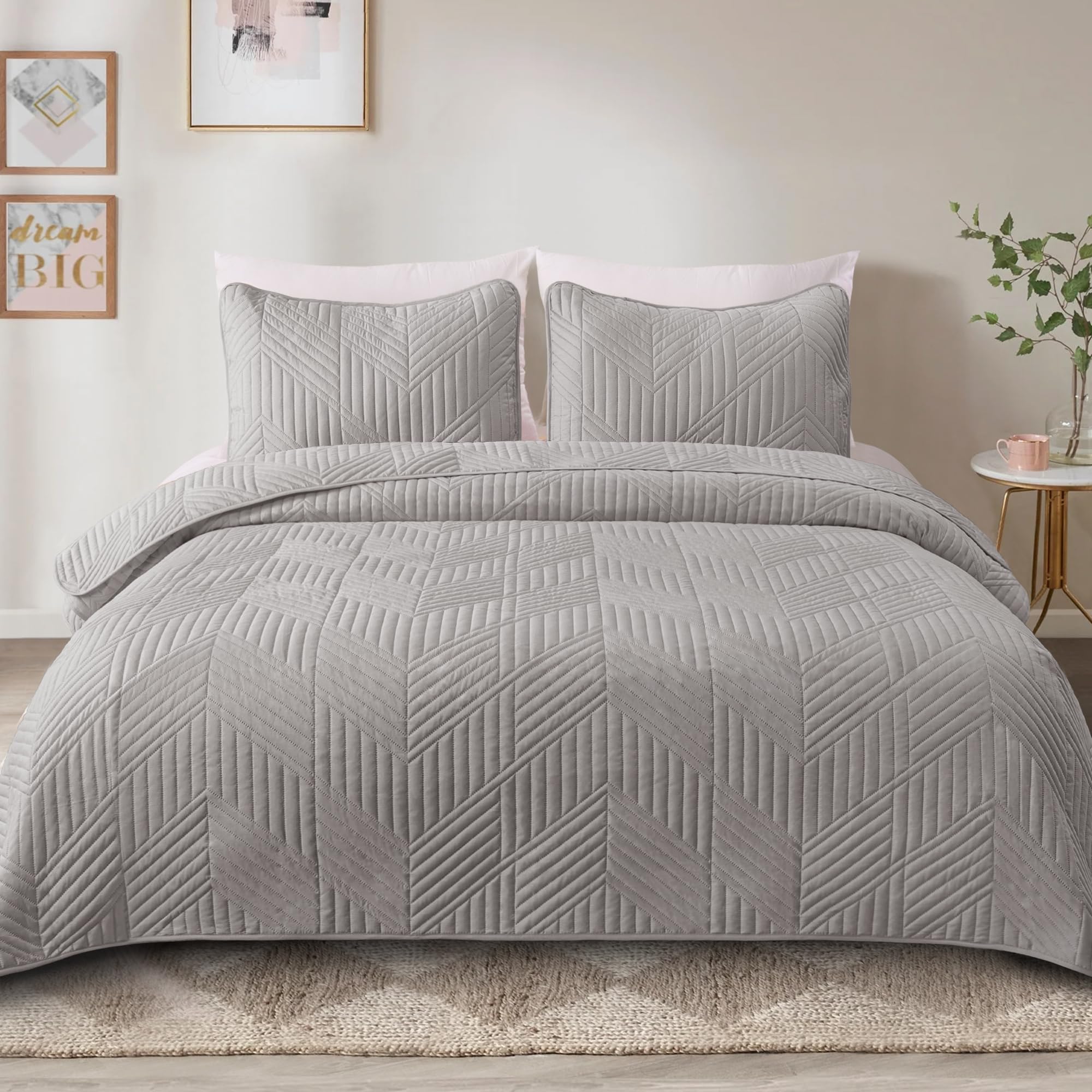 Exclusivo Mezcla two pillow shams complement the quilt for cohesive decor