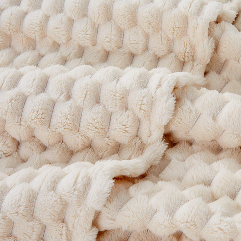 Draped on the couch for warmth and texture.
