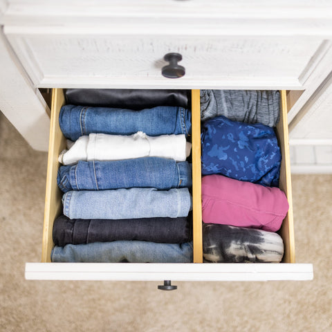 Fabsome wooden divider with spring grip for secure placement.
