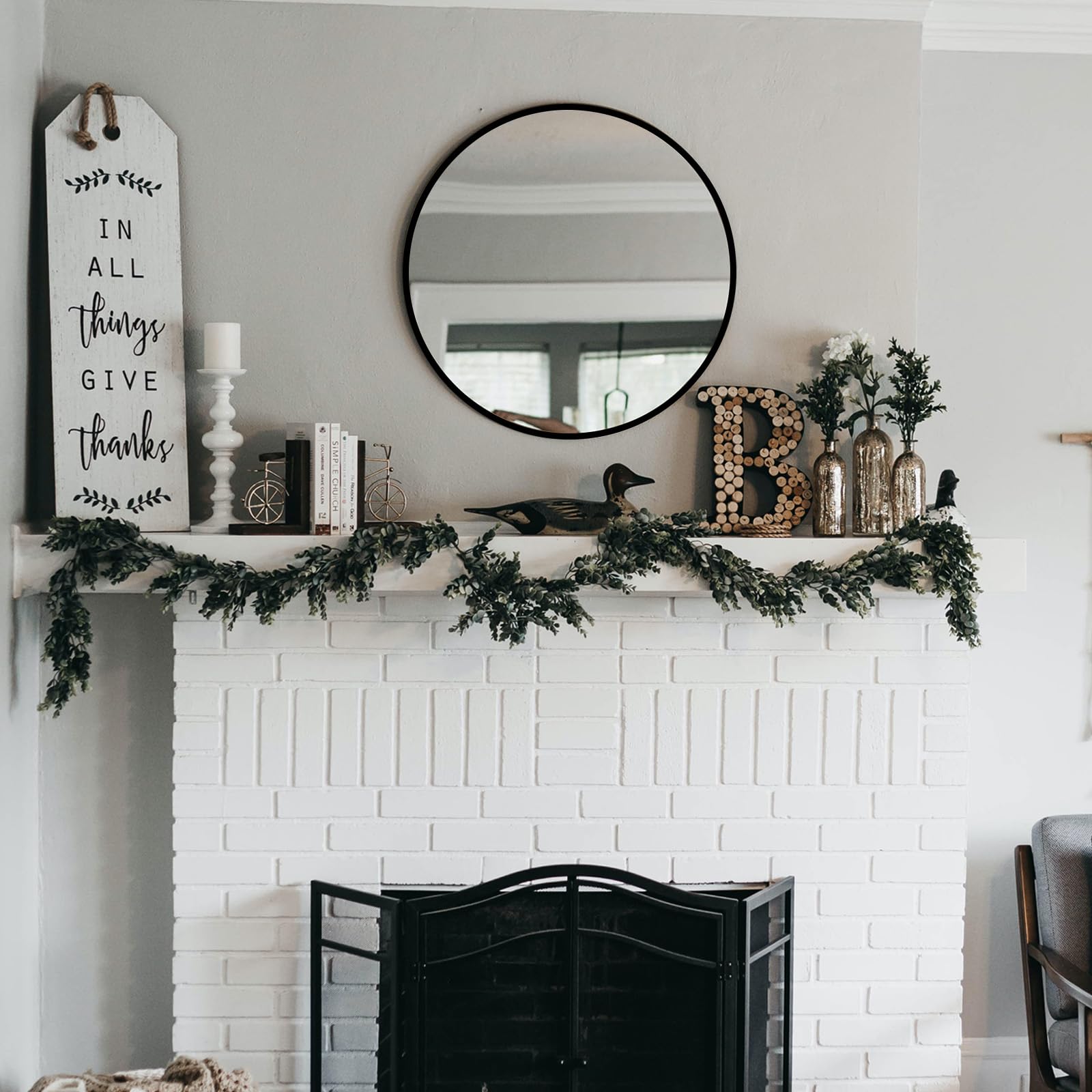 Fabuday round entryway mirror in matte black elevates first impressions.
