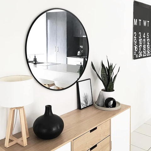 Fabuday round living room mirror reflects light to open up spaces.