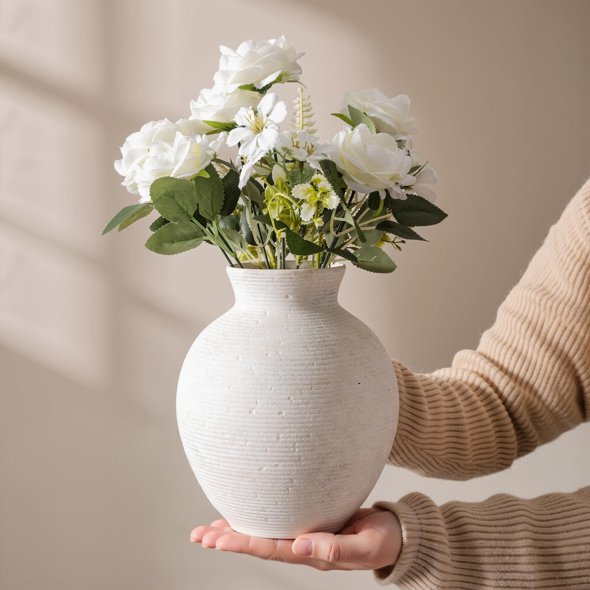FancyPlus ceramic vase on an office desk for elegant decor.