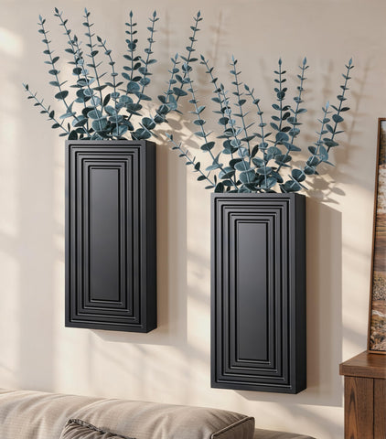 FancyPlus wooden wall vase with black finish hanging beside eucalyptus for warm decor