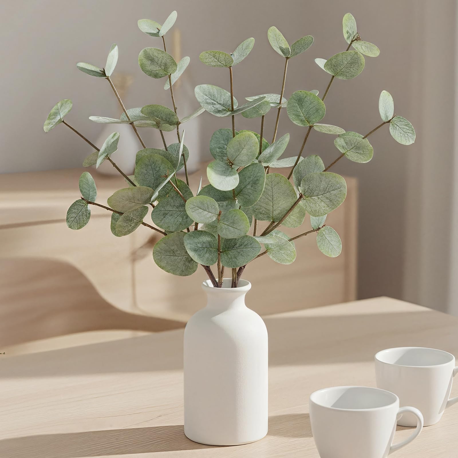 Fawairyc eucalyptus stems in frosted vase closeup for instant ambience.