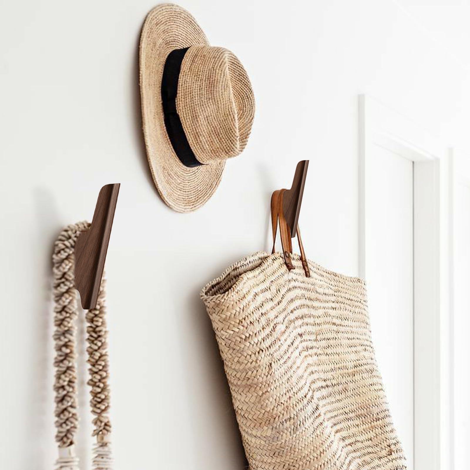 FCOWK wall-mounted hooks provide space-saving storage for hats and backpacks.