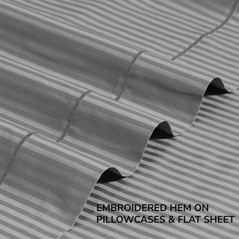 Embroidered flat sheet from Feather & Stitch New York adds refined decor touch